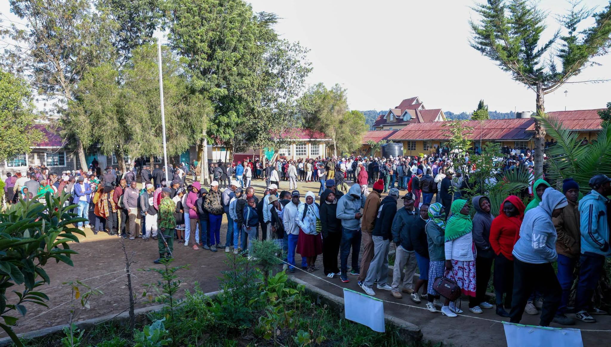 Voters queue at a polling station during the Ol Kalou parliamentary by-election.